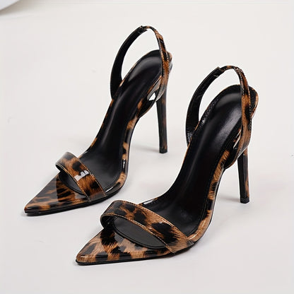 A Pair Of Women's Sandals With Pointed Toes, Thin High Heels, Ankle Straps, And Leopard Print