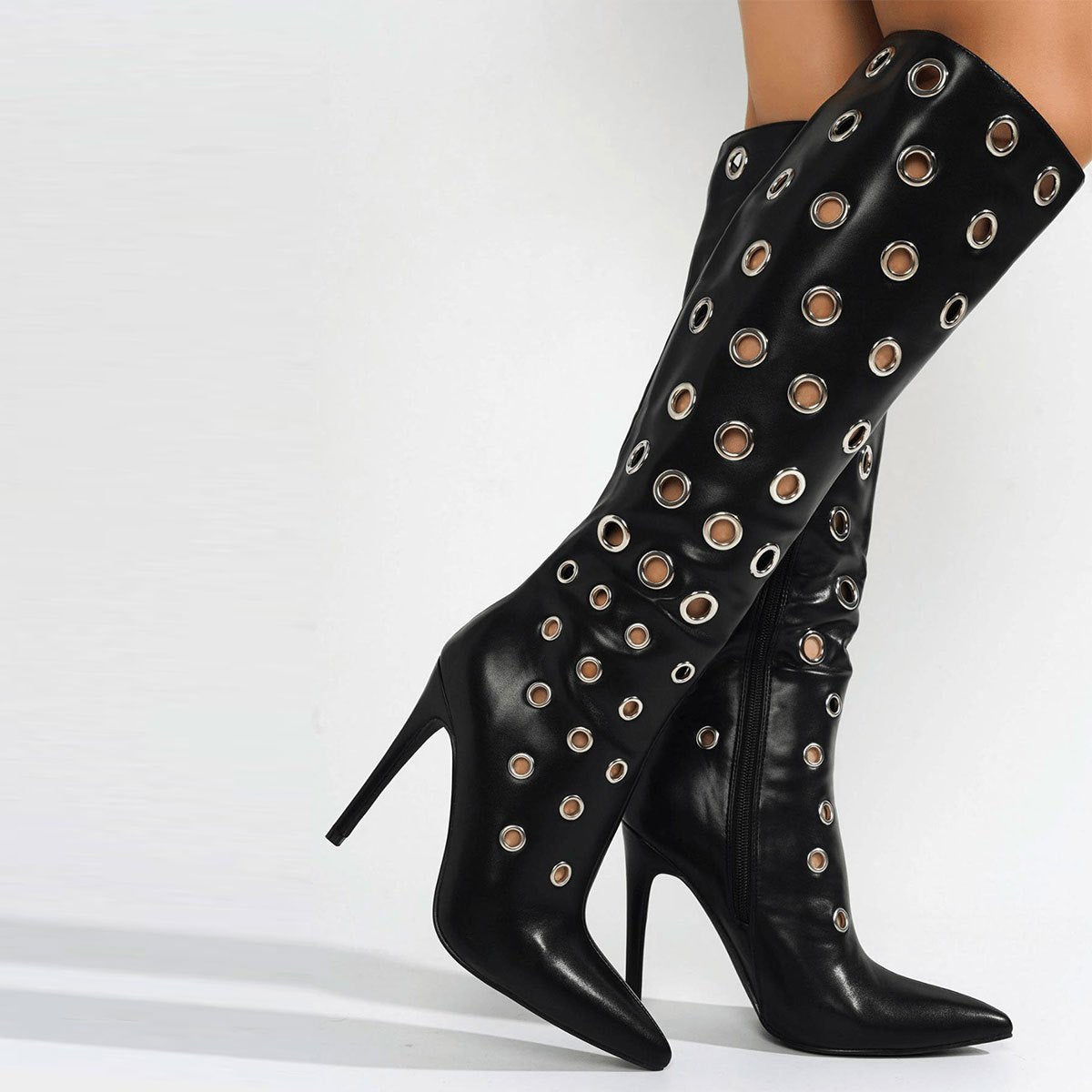 Stiletto high heels, knee high boots with holes