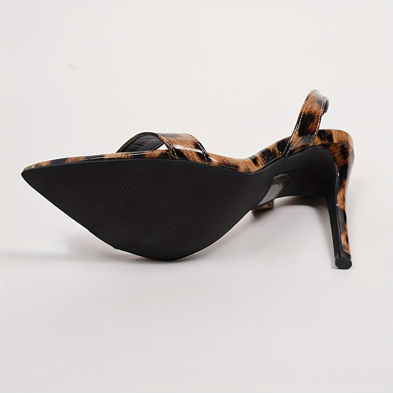 A Pair Of Women's Sandals With Pointed Toes, Thin High Heels, Ankle Straps, And Leopard Print